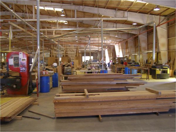 Stack of teak on the factory floor at Teakdecking Systems