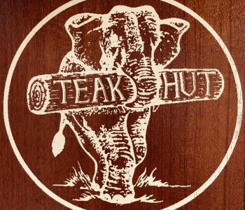 TeakHut Elephant Logo yellow with teak background