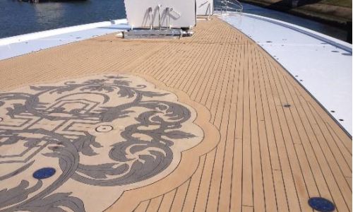 faux teak deck on a motor yacht with intricate design medallion