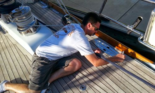 Image of an employee on a boat digitally measuring decks
