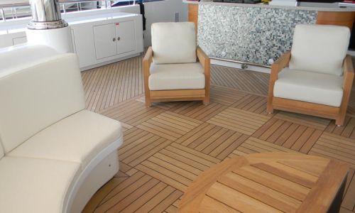 Photo of checkboard pattern teak deck with furniture