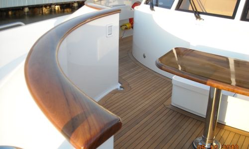 Photo of teak caprails, decking and table on yacht
