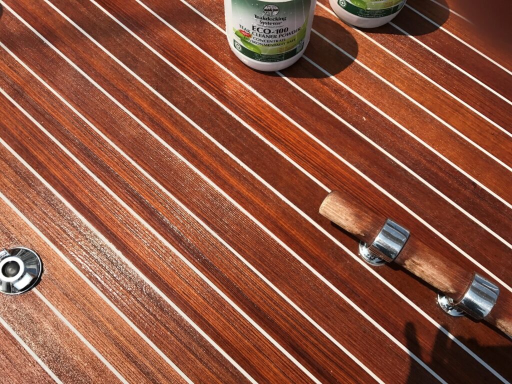 Clean deck with white seams and partial image of ECO-100 cleaner