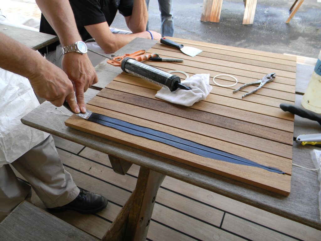 Proper application of caulk to teak deck seams demonstration
